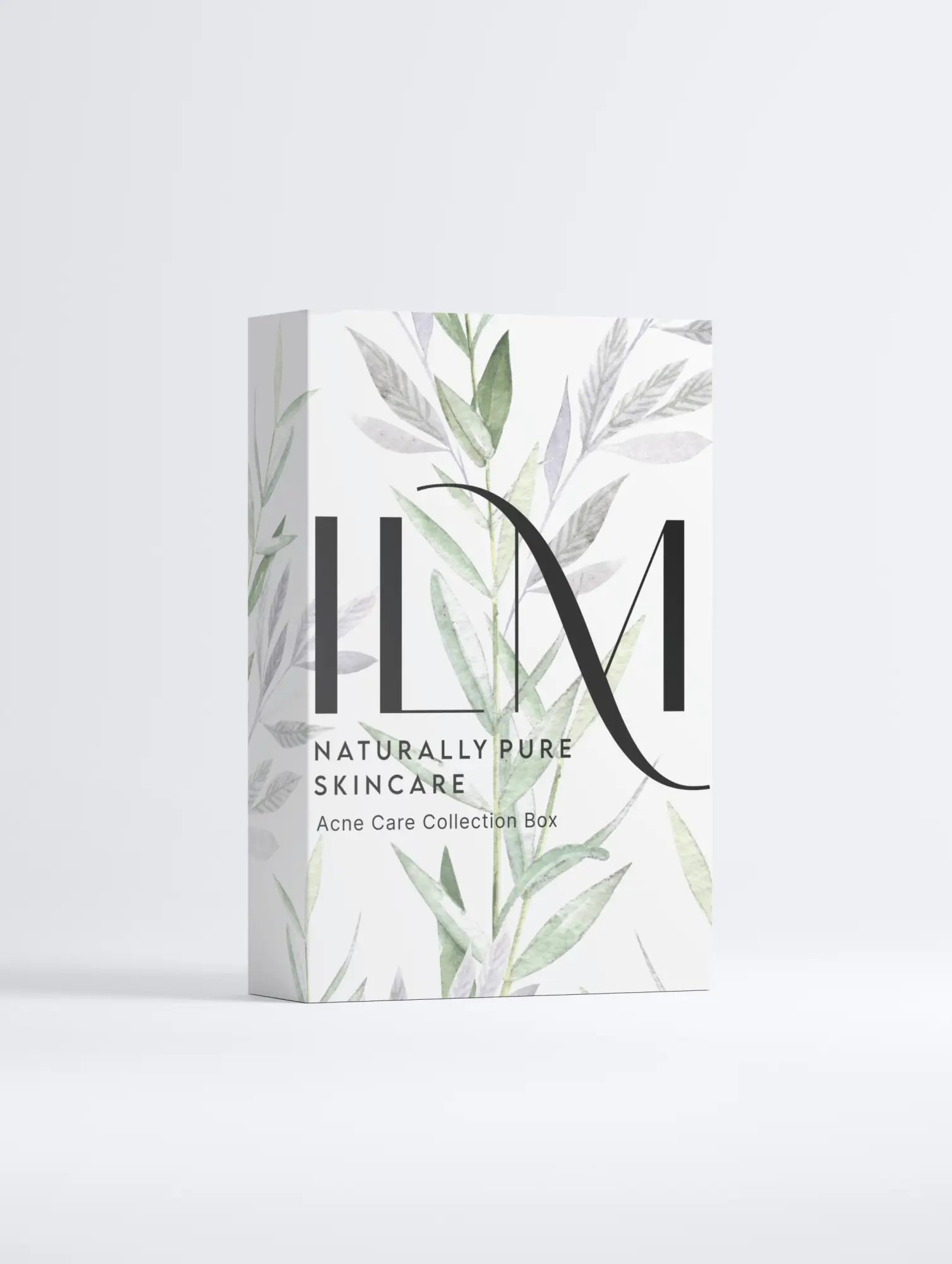 White product box with ’IIM’ branding and botanical leaf designs in soft gray and green tones.